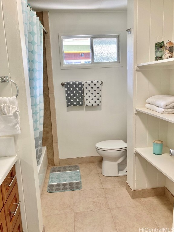 full bathroom with toilet, vanity, shower / bath combination with curtain, and tile patterned flooring