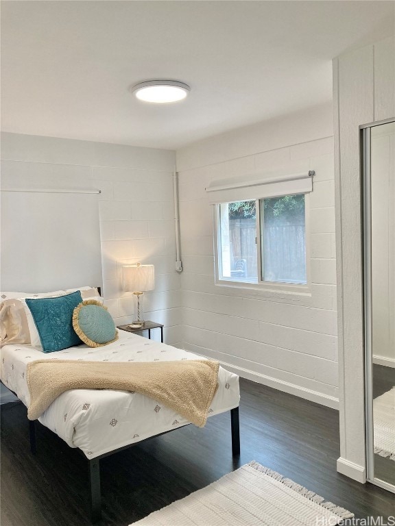 bedroom featuring dark wood-type flooring