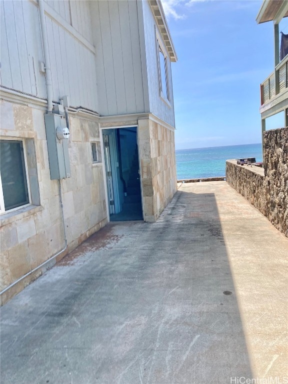 view of patio with a water view