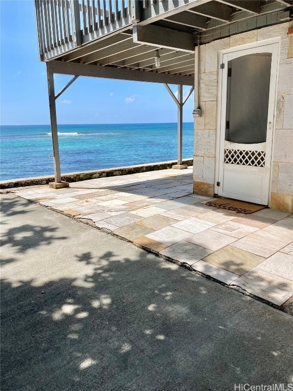 view of patio featuring a water view