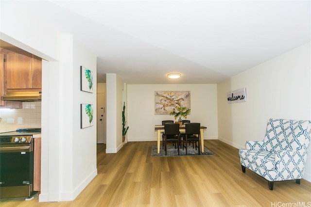 dining area with hardwood / wood-style floors