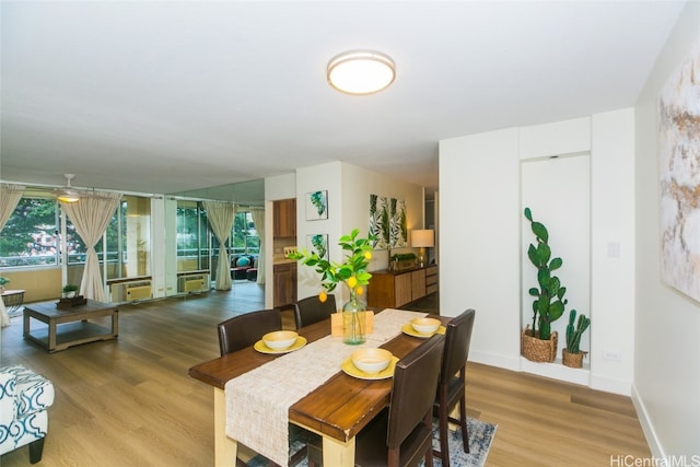 dining room featuring light wood-type flooring and ceiling fan