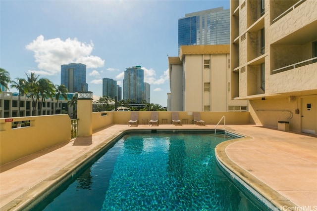 view of pool featuring a patio