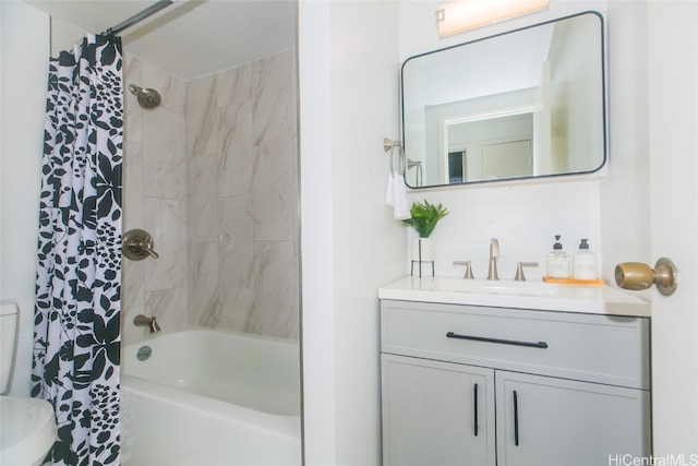 full bathroom featuring vanity, shower / bath combo, and toilet