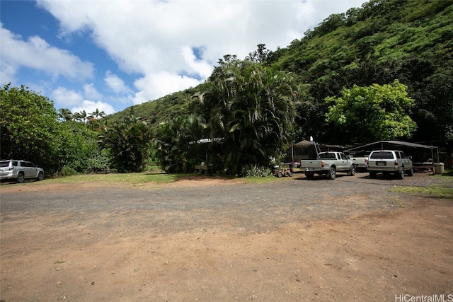 view of parking / parking lot with a carport