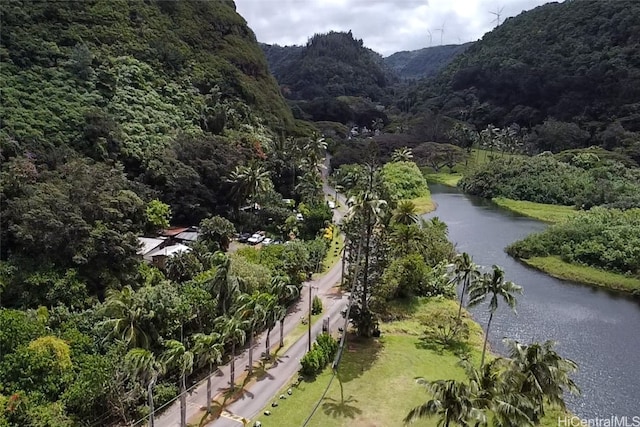 surrounding community with a water and mountain view