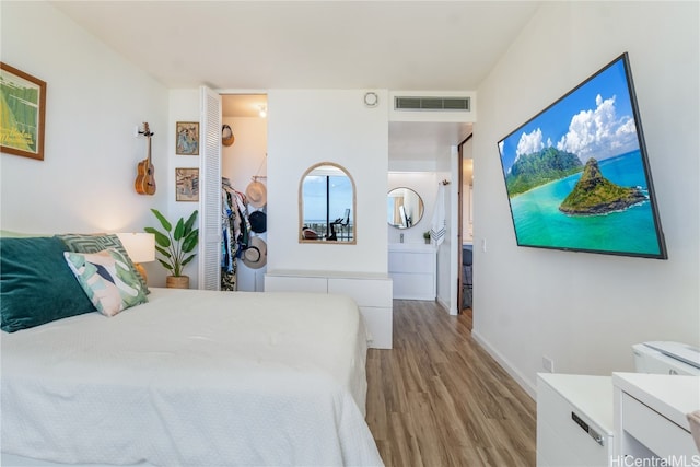 bedroom with light wood-type flooring