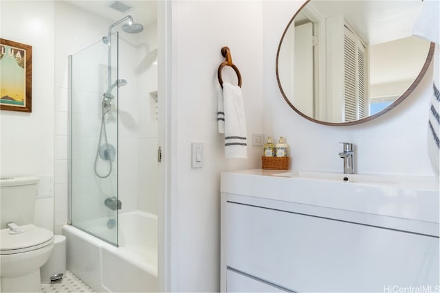 full bathroom featuring bath / shower combo with glass door, tile patterned flooring, vanity, and toilet