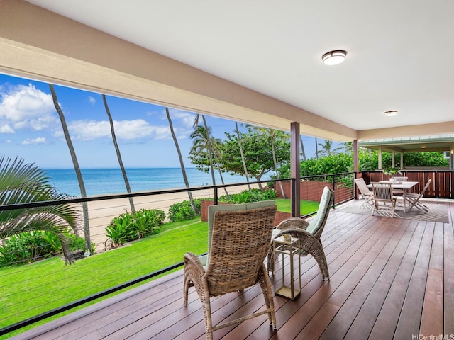 59-355 Ke Nui Rd, Haleiwa, HI 96712 - wooden deck featuring a water view, outdoor dining space, and a yard