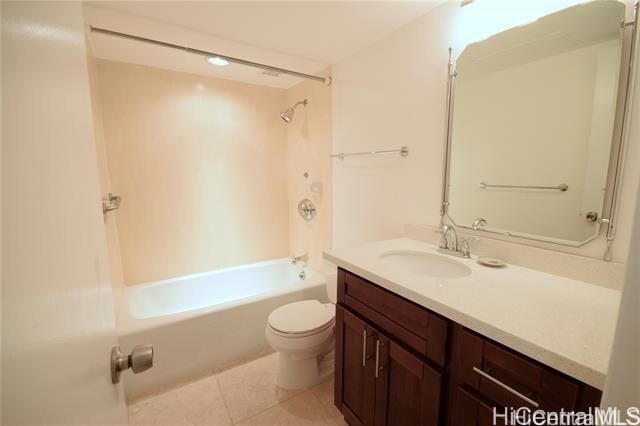 full bathroom with vanity, toilet, tile patterned floors, and washtub / shower combination