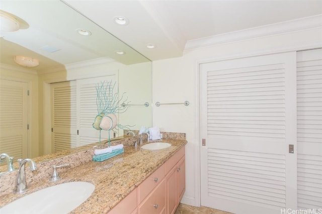 bathroom with vanity and ornamental molding