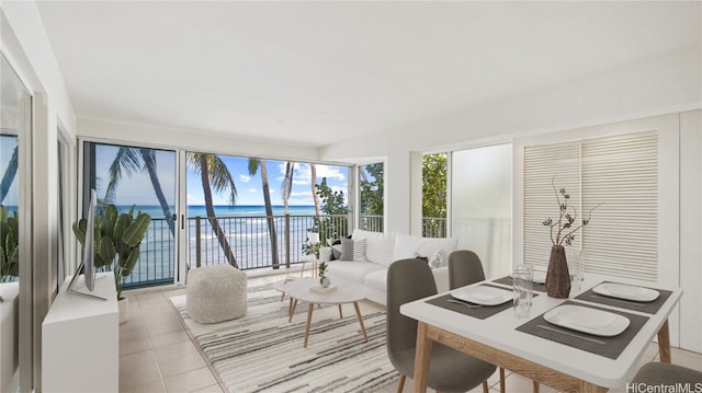 office area with a water view and light tile patterned floors