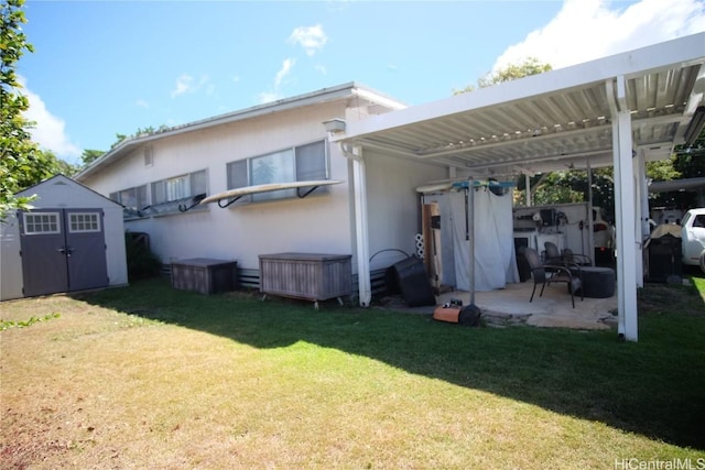 back of property featuring a lawn, a pergola, a patio, and a storage shed