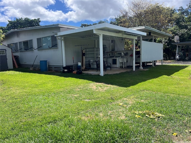 1629 Kino St Unit F, Honolulu, HI 96819 - back of property with a lawn and a patio