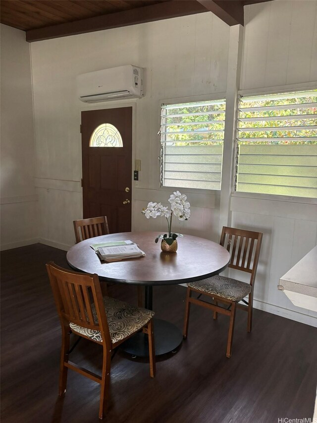 1629 Kino St Unit F, Honolulu, HI 96819 - dining area featuring a wall mounted air conditioner, wood finished floors, a decorative wall, and baseboards