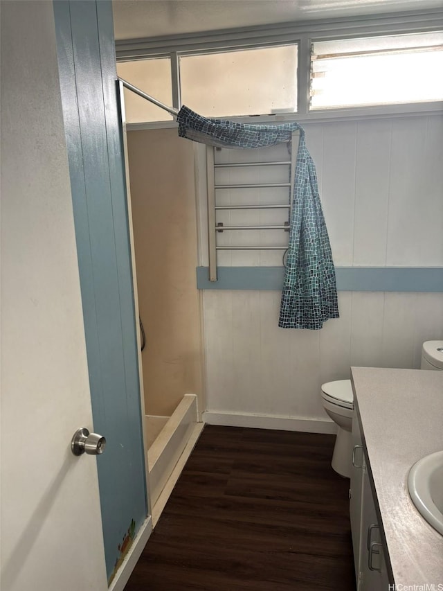 1629 Kino St Unit F, Honolulu, HI 96819 - bathroom featuring toilet, wood finished floors, a shower, vanity, and baseboards