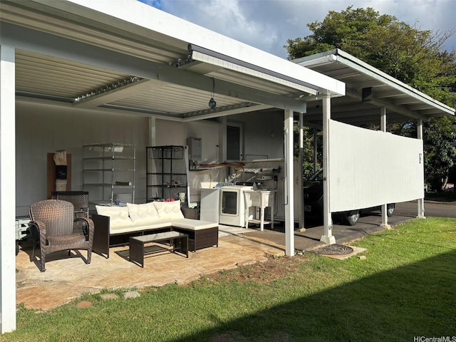 1629 Kino St Unit F, Honolulu, HI 96819 - view of patio featuring an outdoor hangout area and washing machine and clothes dryer