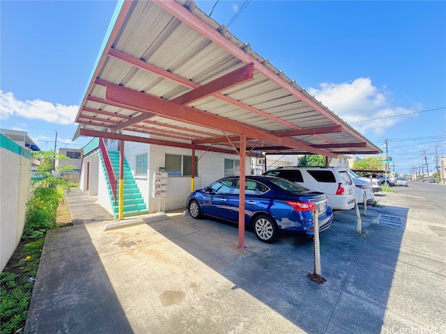 view of vehicle parking with a carport