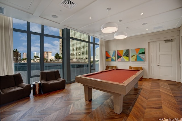 rec room with pool table, a wall of windows, and parquet floors