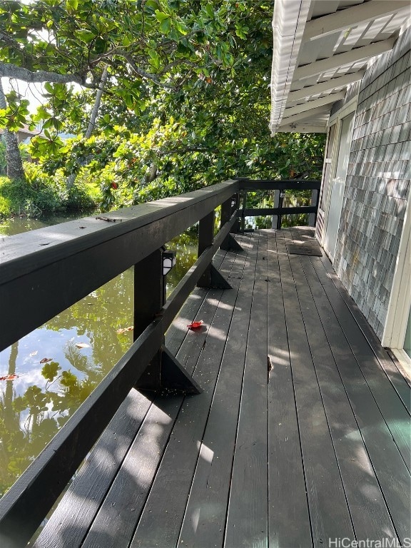 wooden deck with a water view