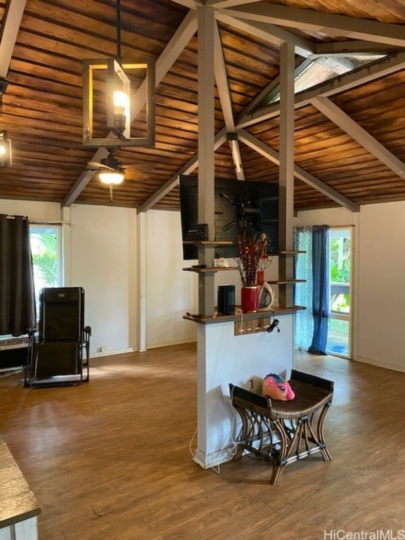 kitchen featuring a healthy amount of sunlight, wood ceiling, and lofted ceiling with beams