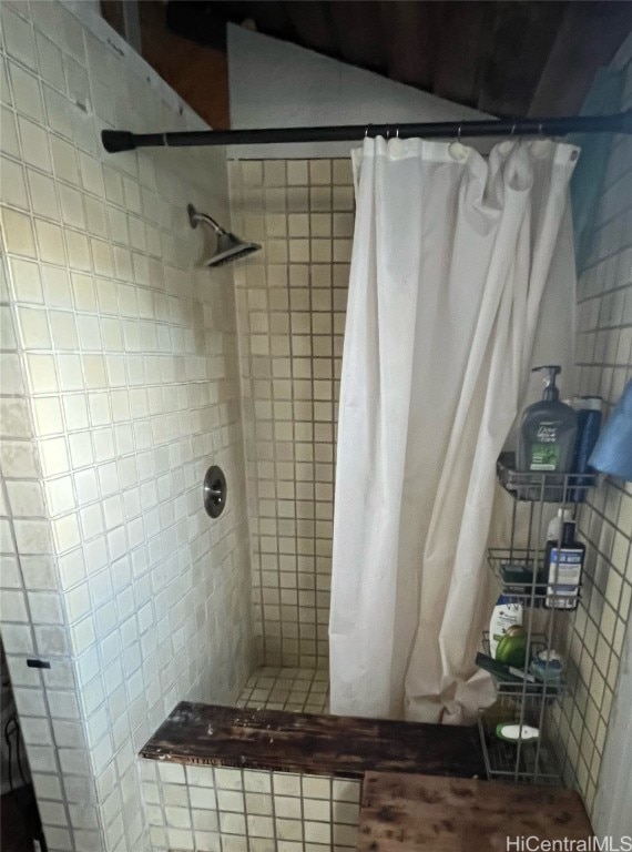 bathroom with curtained shower