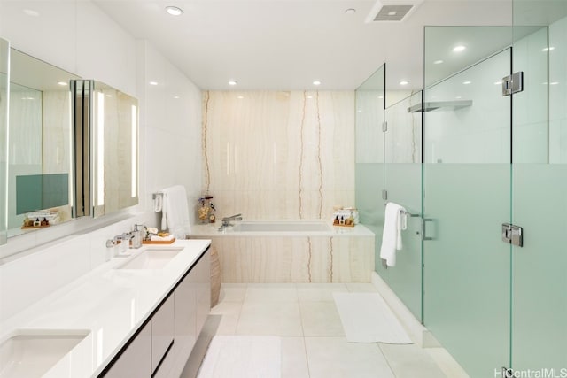 bathroom with vanity, shower with separate bathtub, and tile patterned flooring