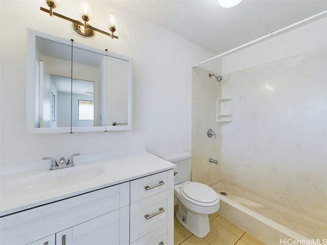 bathroom featuring vanity, toilet, walk in shower, and tile patterned flooring