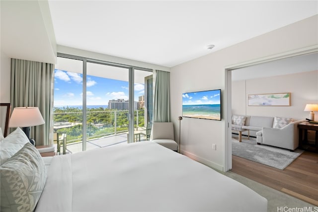 bedroom featuring access to outside and light hardwood / wood-style flooring