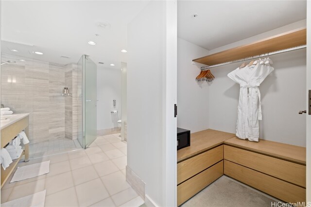 bathroom featuring a shower with shower door