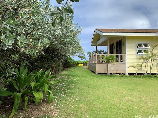 view of yard featuring a wooden deck