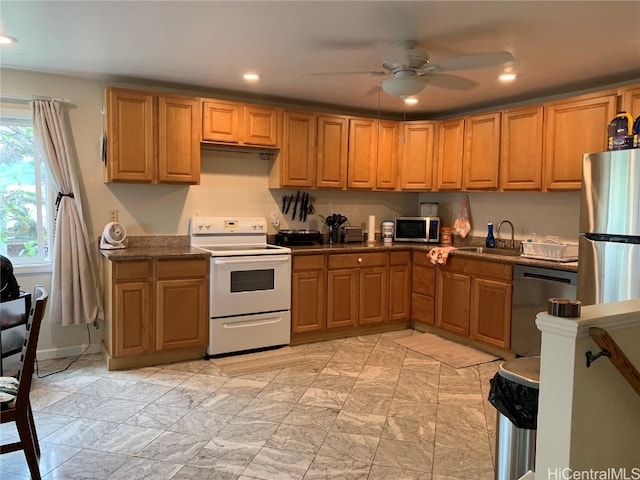 kitchen with sink, stainless steel appliances, and ceiling fan