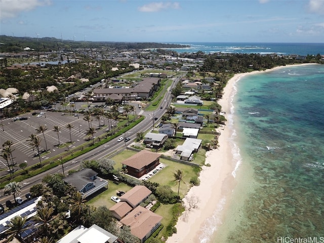 aerial view with a water view and a view of the beach