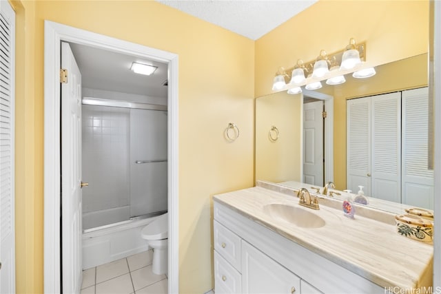 full bathroom featuring vanity, toilet, tile patterned floors, and shower / bath combination with glass door