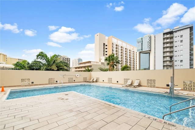 view of swimming pool featuring a patio area