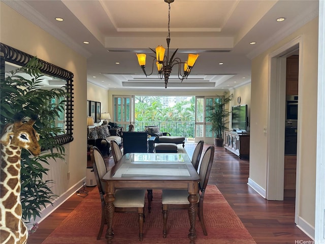 1740 S Beretania St Unit 33, Honolulu, HI 96826 - dining area featuring a tray ceiling, a chandelier, wood finished floors, crown molding, and baseboards