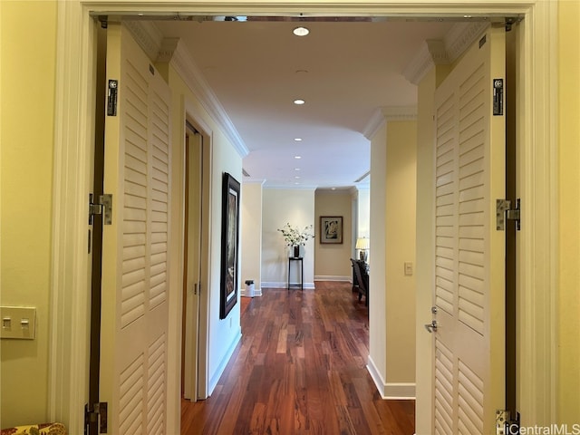 corridor with crown molding and dark hardwood / wood-style flooring