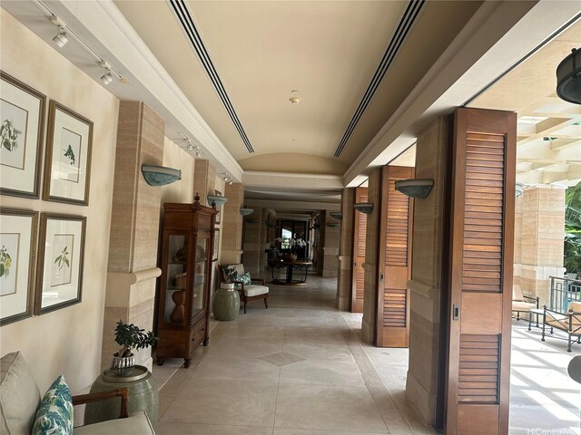 1740 S Beretania St Unit 33, Honolulu, HI 96826 - hallway with vaulted ceiling, light tile patterned floors, and rail lighting