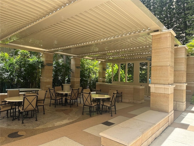 1740 S Beretania St Unit 33, Honolulu, HI 96826 - view of patio / terrace featuring a pergola and outdoor dining space