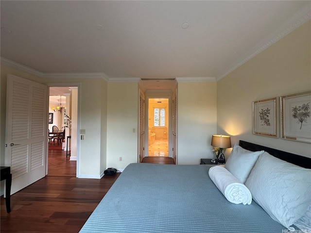 1740 S Beretania St Unit 33, Honolulu, HI 96826 - bedroom with dark wood-style flooring, ornamental molding, baseboards, and ensuite bath