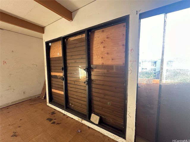 87-213 Helelua Pl Unit 1, Waianae, HI 96792 - doorway featuring beamed ceiling and tile patterned floors