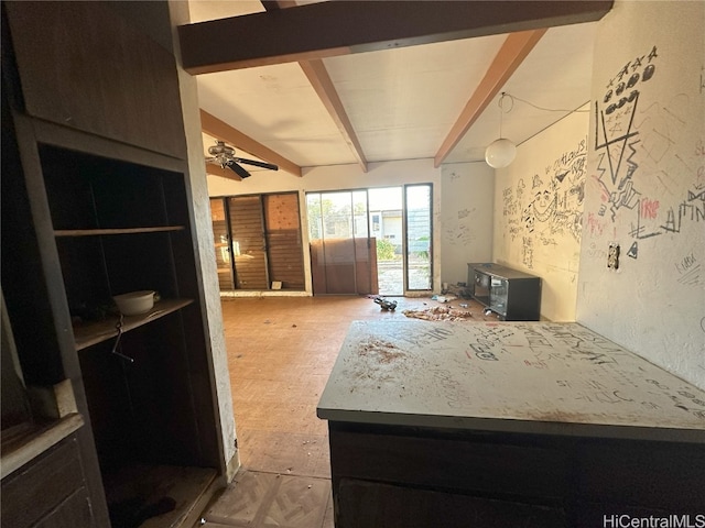 interior space featuring beamed ceiling and ceiling fan