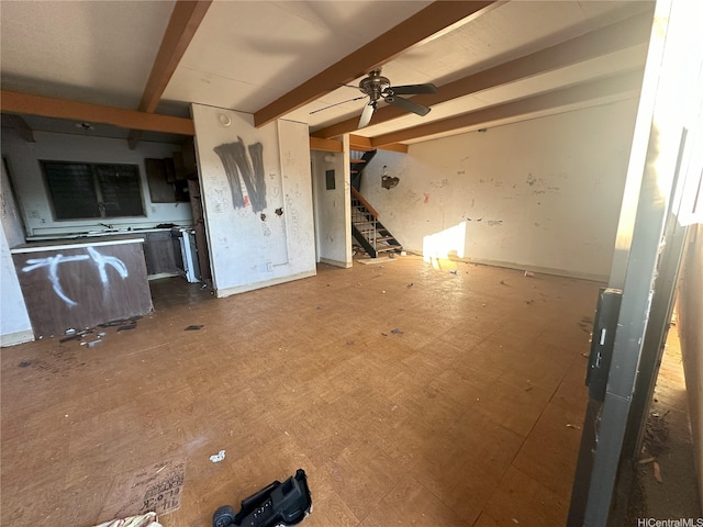 87-213 Helelua Pl Unit 1, Waianae, HI 96792 - unfurnished living room featuring beamed ceiling, stairway, and ceiling fan