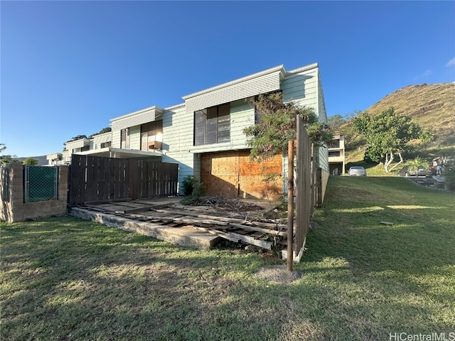 view of side of home featuring a lawn