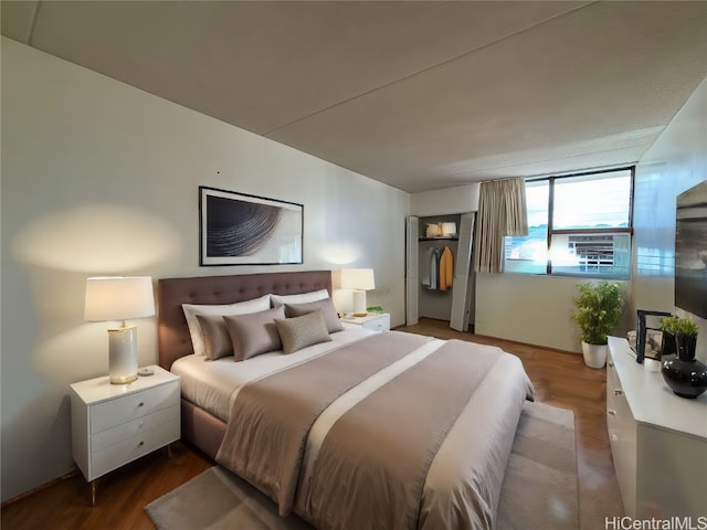 bedroom with wood-type flooring