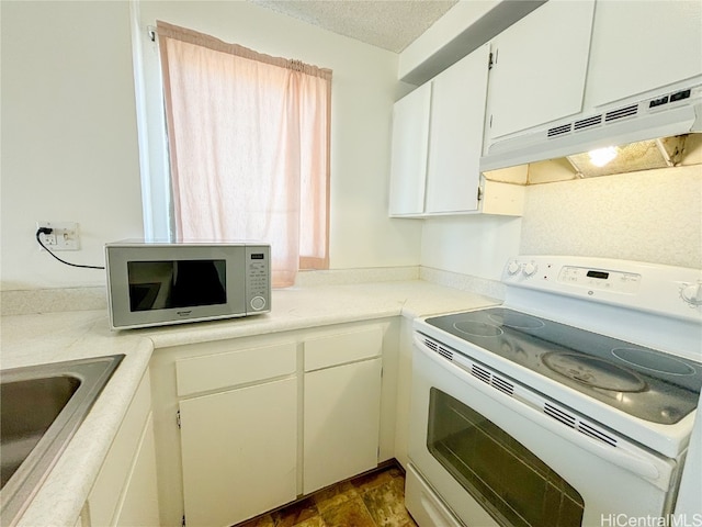 kitchen featuring white cabinets, a textured ceiling, white electric range, and sink