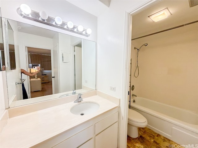 full bathroom with toilet, vanity, and washtub / shower combination