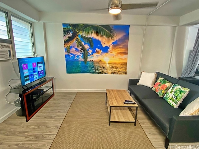 living room featuring hardwood / wood-style flooring and ceiling fan