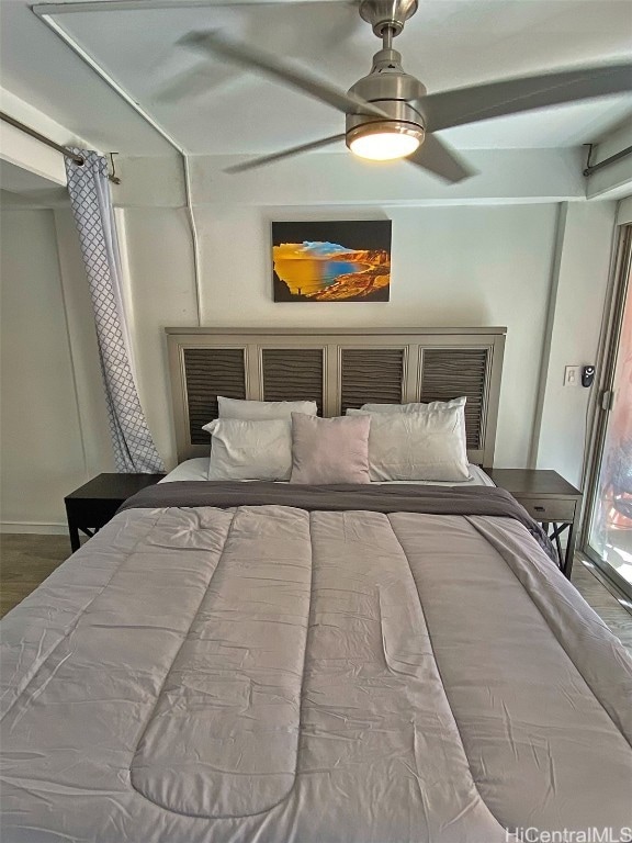 bedroom with hardwood / wood-style flooring and ceiling fan