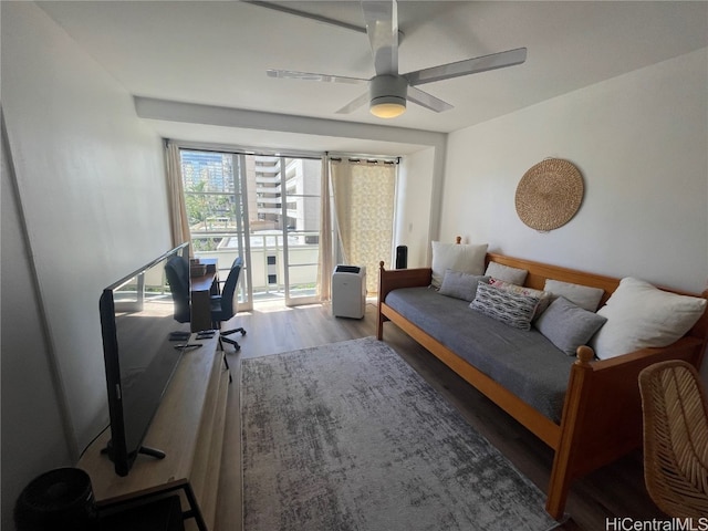 bedroom featuring ceiling fan and wood-type flooring